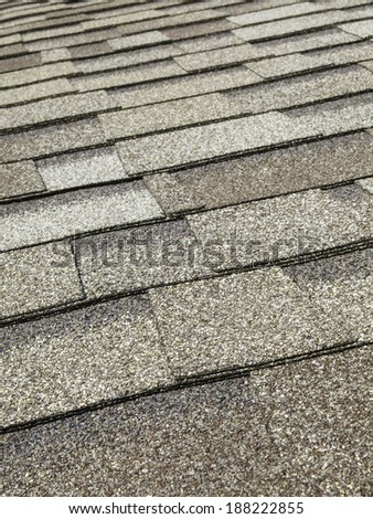 Asphalt roof shingles (foreground focus)