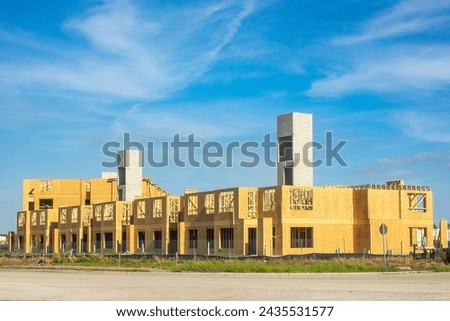 Similar – Image, Stock Photo Building complex in shell with scaffolding for the creation of living space in the Rhine-Main area in front of a blue sky with sunshine in Offenbach on the Main in Hesse