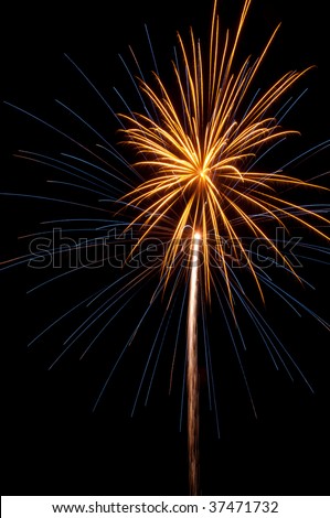 Rocket trail to fireworks burst with blue streaks below smaller, orange burst