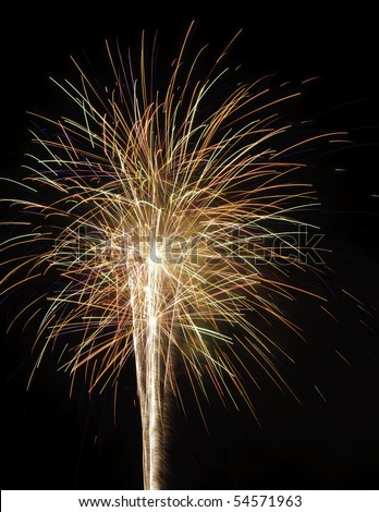 Several bursts of low-altitude multicolored fireworks together with rocket trails -- see many more in my portfolio