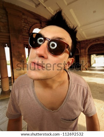 weird man in sunglasses making faces