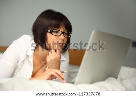 beautiful young lady working on laptop