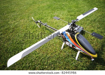 remote controlled helicopter against grass