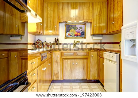 Shiny kitchen room with honey storage combination. Room has white and black appliances