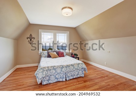 Elegant bedroom interior  in light ivory tone Furnished with bed in light blue  with colorful pillows