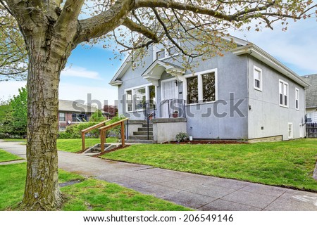 Big old house exterior. View of entrance porch with stairs and walkway