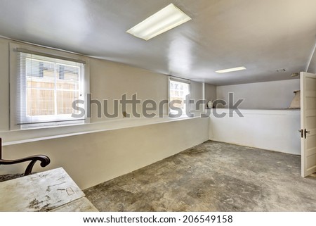 Old empty basement room with concrete floor