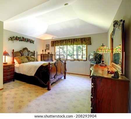 Large green walls traditional American master bedroom.