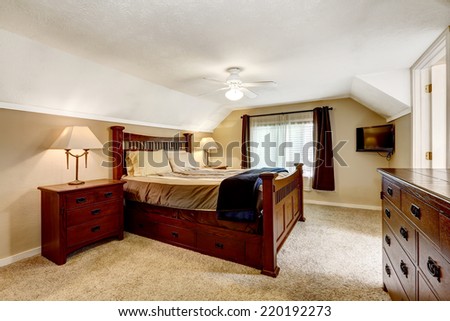 Low ceiling master bedroom with rich furniture set