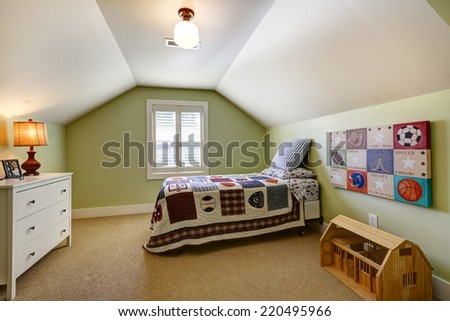 Simple bedroom interior with vaulted ceiling and light green walls. Single bed and dresser in the room