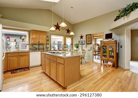 Traditional kitchen with dinning area and hardwood floor.