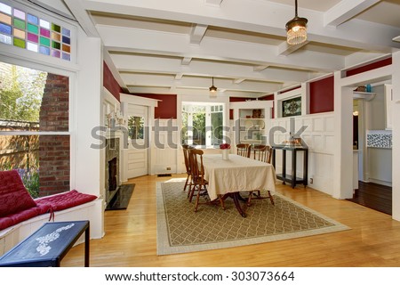 Exquisite dinning room with autumn colored decor, and white table cloth.