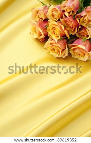yellow and pink roses on gold satin