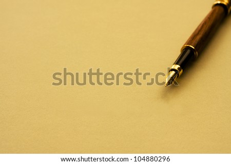 A fountain pen with yellow paper with copy-space, Writing a note