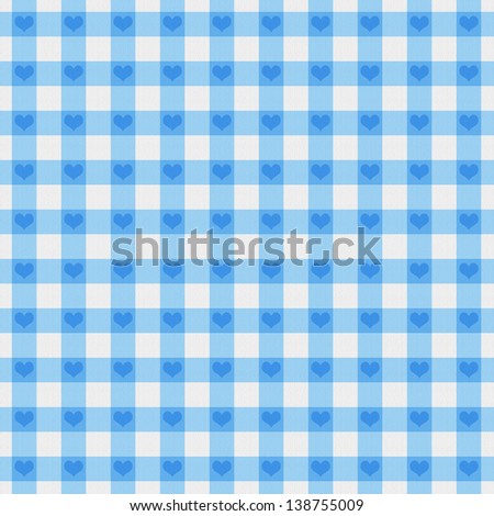 A light blue gingham fabric with hearts background that is seamless