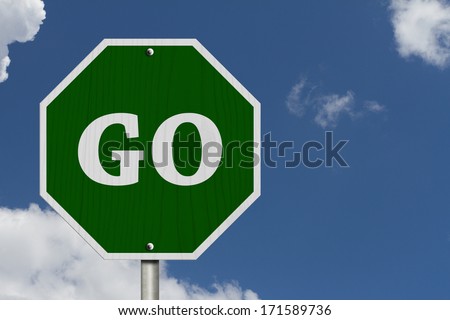 Go Sign, An American road sign and words Go with blue sky