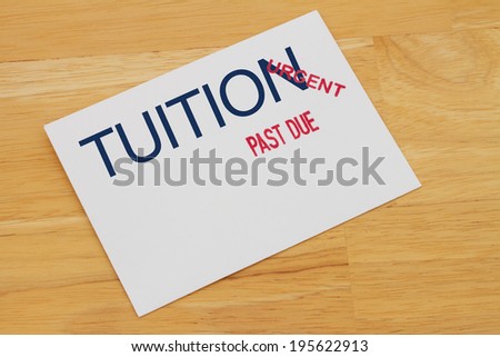 Tuition Payment envelop with past due and urgent stamps on a wooden desk