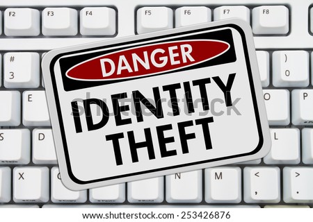 Identity Theft Danger Sign,  A red and white sign with the words Identity Theft on a keyboard