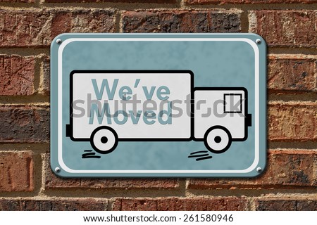 We have Moved Sign,  A blue sign with the word We\'ve Moved with a truck on a brick wall