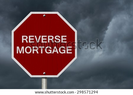 Stop Reverse Mortgage Road Sign, Stop sign with words Reverse Mortgage with stormy sky background