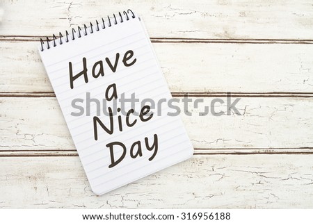 Have a Nice Day, A spiral Notepad that has the words Have a Nice Day over a distressed wood background