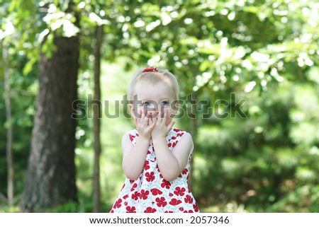 Happy little girl playing palying outside - copy space