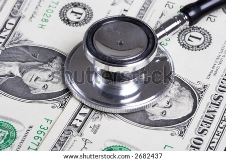 Stethoscope on money background of one dollar bills