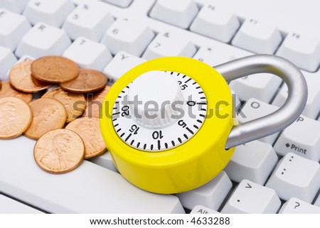 A combination lock with money on a keyboard