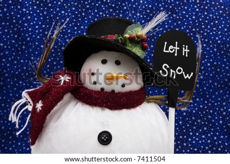 Snowman holding sign with a star background