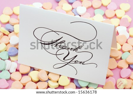Thank you card on candy heart background