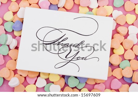 Thank you card on candy heart background