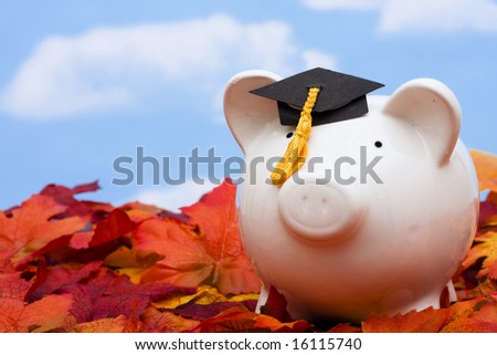 Piggy bank with a graduation cap â?? the cost of education