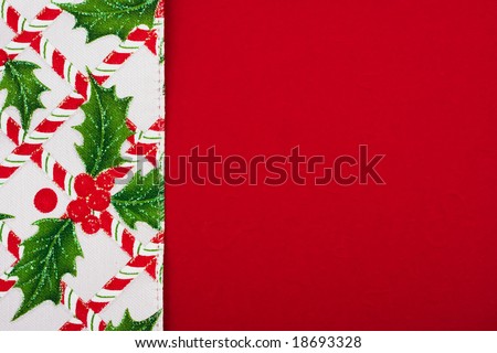 Candy cane, holly berries and leaf border on red background, Christmas border