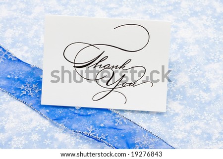 Thank you card with ribbon on blue snowflake background, thank you card