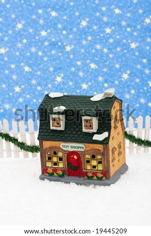 Toy store and white picket fence with green garland and red bow, merry Christmas
