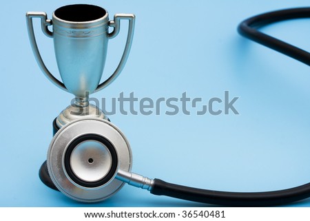 A trophy and stethoscope on a blue background, award winning healthcare services