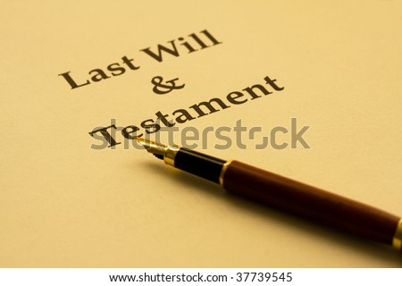 A piece of paper with Last Will And Testament and a pen, writing your will