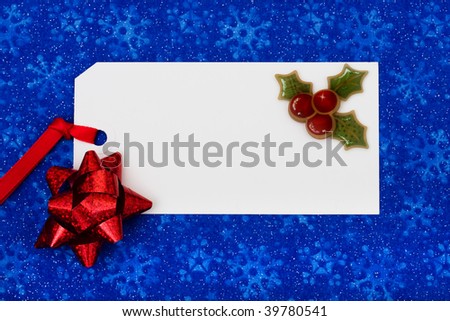 A blank gift tag on a blue snowflake background, Christmas gifts