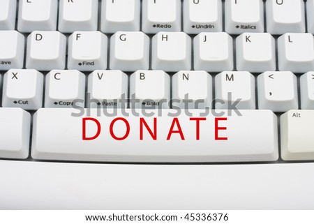 The word donate in red on a computer keyboard, Online donation