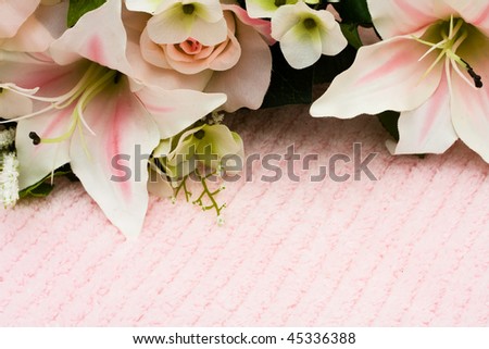 A bouquet of colourful flowers with a pink background