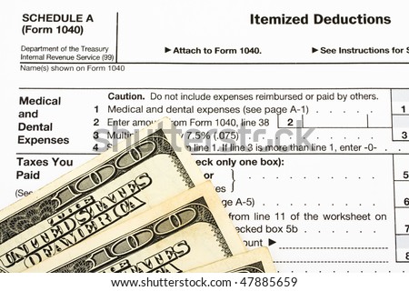 One hundred dollar bills sitting on tax papers, Federal Tax Forms for Items Deductions