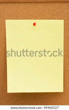A note on yellow lined paper tacked to a corkboard, Write your own message