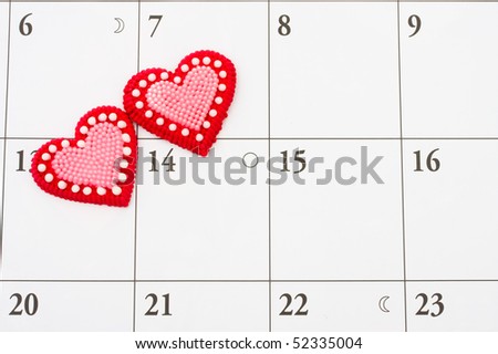 Two red hearts on a calendar background, date night