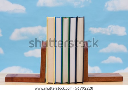 A stack of book between book end with a sky background, Learning