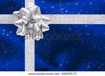 A ribbon and bow on a blue background, christmas present