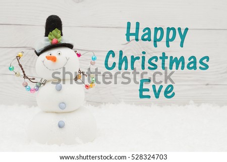 Happy Christmas Eve Greeting, Some Snow And A Snowman On Weathered Wood