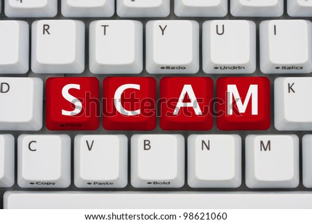 A computer keyboard with red keys spelling scam, Internet Scams