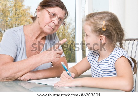 Grandmother and granddaughter making lessons