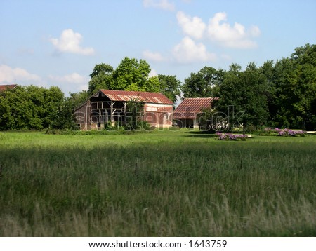 Scenic old barn with stone foundation.