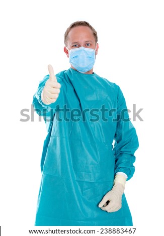 young doctor with surgical mask and green coat with thumb up